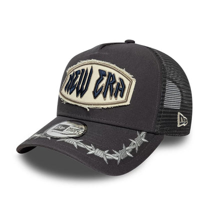 Pictured is this New Era Distressed Patch 9FORTY E-Frame Trucker cap in charcoal. 1