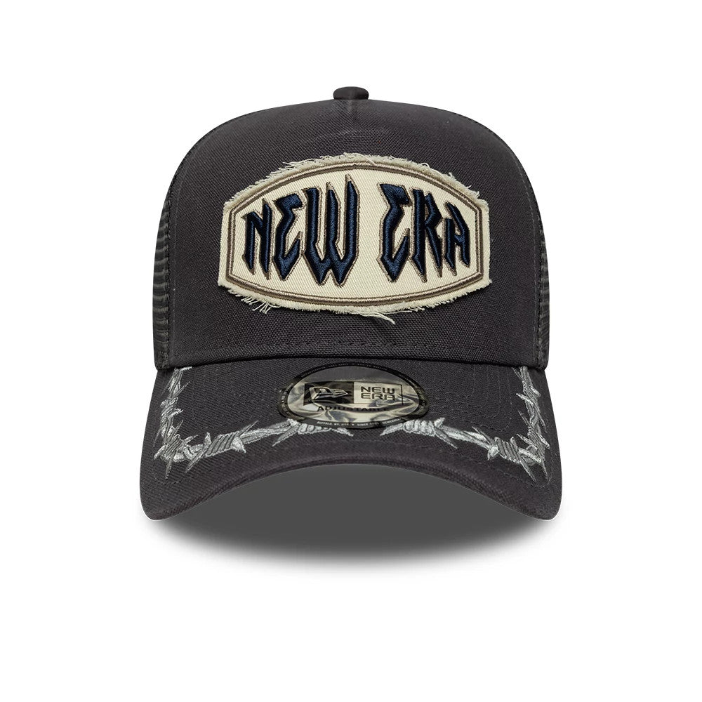 New Era Distressed Patch Charcoal 9FORTY E-Frame Trucker Adjustable Cap, front view showing the large cream patch with black and navy embroidered New Era lettering on the structured charcoal crown.