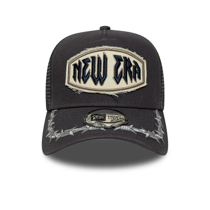 New Era Distressed Patch Charcoal 9FORTY E-Frame Trucker Adjustable Cap, front view showing the large cream patch with black and navy embroidered New Era lettering on the structured charcoal crown.