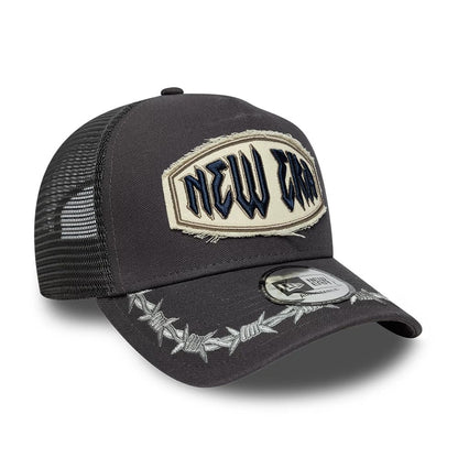 Pictured is this New Era Distressed Patch 9FORTY E-Frame Trucker cap in charcoal. 3