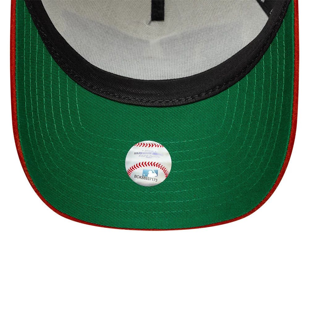New York Yankees MLB Suede Cream & Orange New Era 9FORTY E-Frame Adjustable Cap, inside view showing the green undervisor with a reflective MLB sticker, contrasting red edge stitching, and black sweatband lining the interior.
