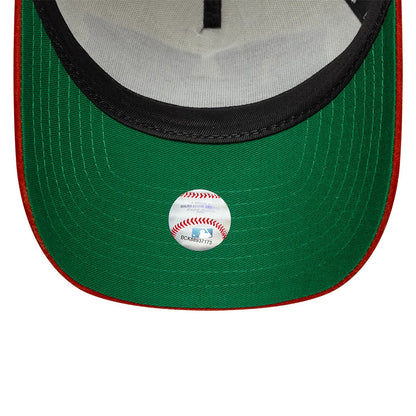 New York Yankees MLB Suede Cream & Orange New Era 9FORTY E-Frame Adjustable Cap, inside view showing the green undervisor with a reflective MLB sticker, contrasting red edge stitching, and black sweatband lining the interior.