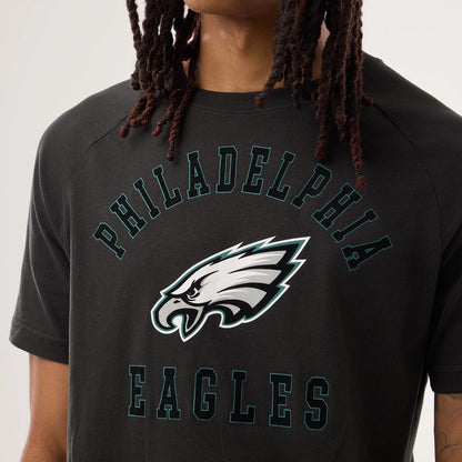 The model is wearing this NFL Sideline 2026 Philadelphia Eagles T-Shirt in black. 3