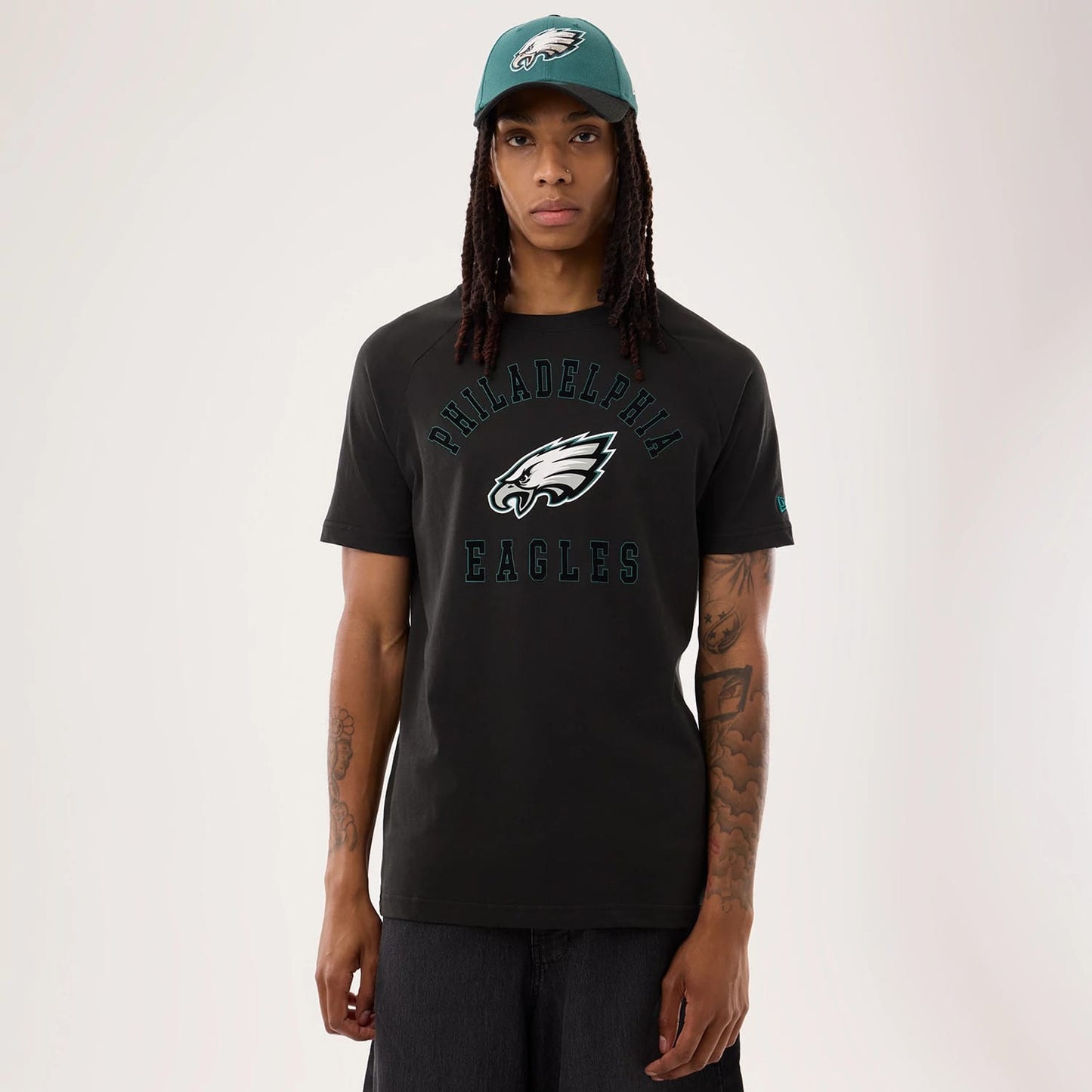 The model is wearing this NFL Sideline 2026 Philadelphia Eagles T-Shirt in black. 1