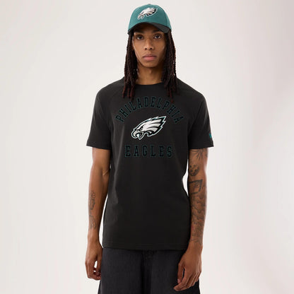 The model is wearing this NFL Sideline 2026 Philadelphia Eagles T-Shirt in black. 1