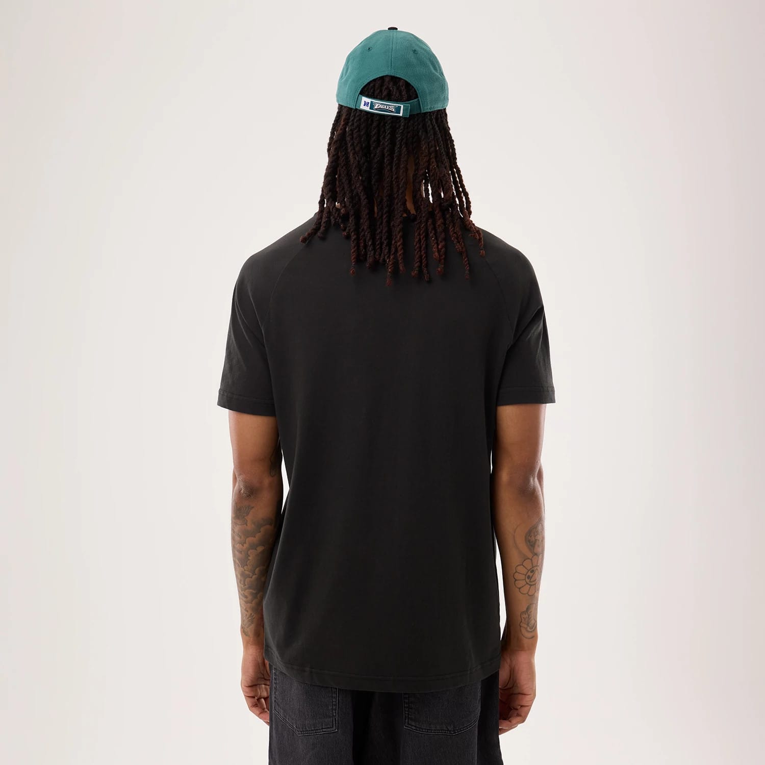 The model is wearing this NFL Sideline 2026 Philadelphia Eagles T-Shirt in black. 2