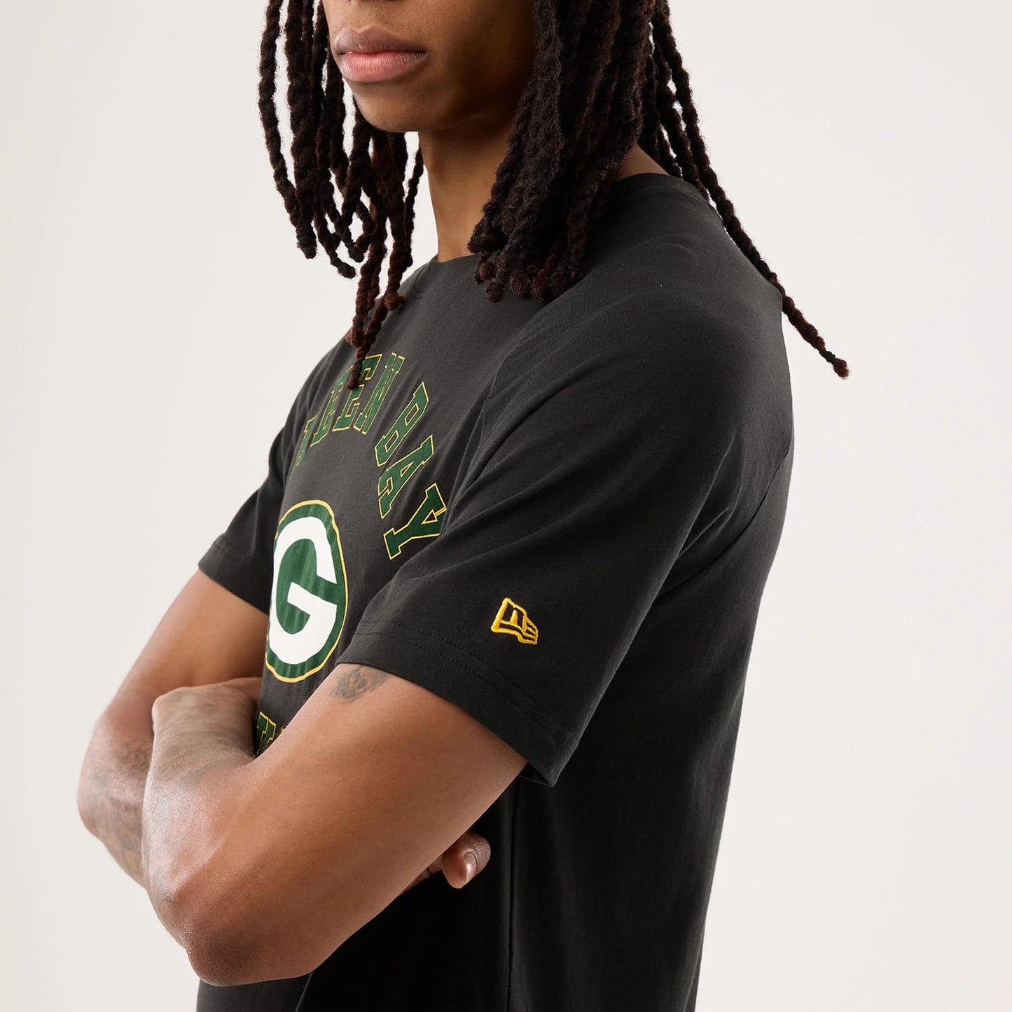 The model is wearing this NFL Sideline 2026 Green Bay Packers T-Shirt in black. 6