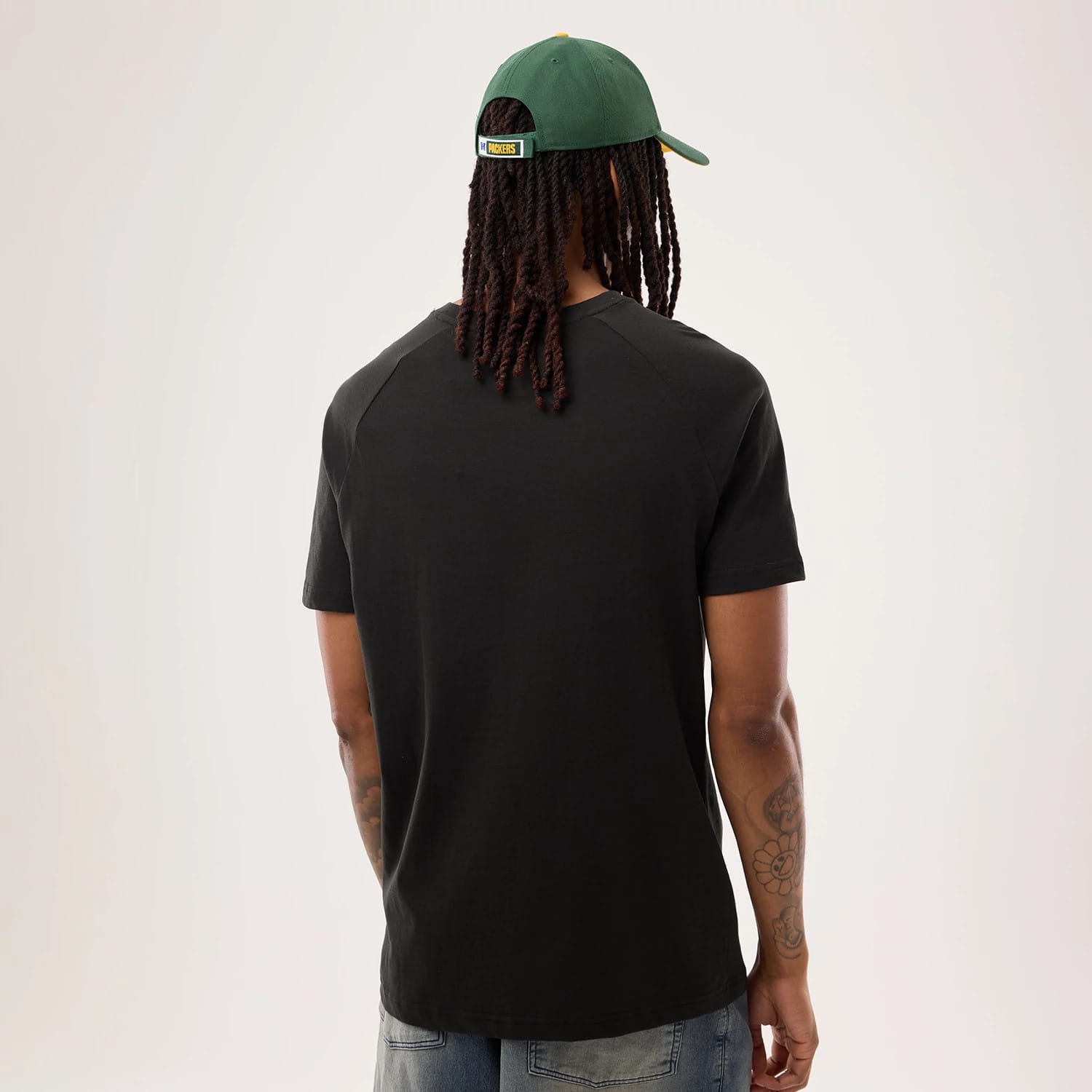 The model is wearing this NFL Sideline 2026 Green Bay Packers T-Shirt in black. 2