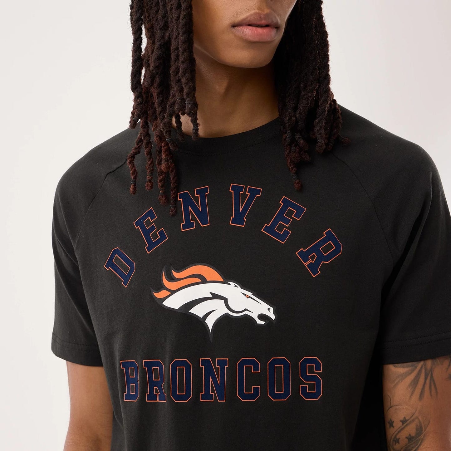 The model is wearing this NFL Sideline 2026 Denver Broncos T-Shirt in black. 4