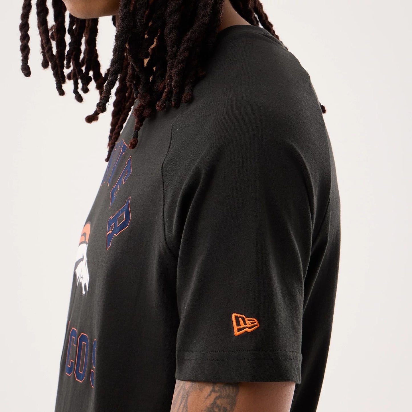 The model is wearing this NFL Sideline 2026 Denver Broncos T-Shirt in black. 5
