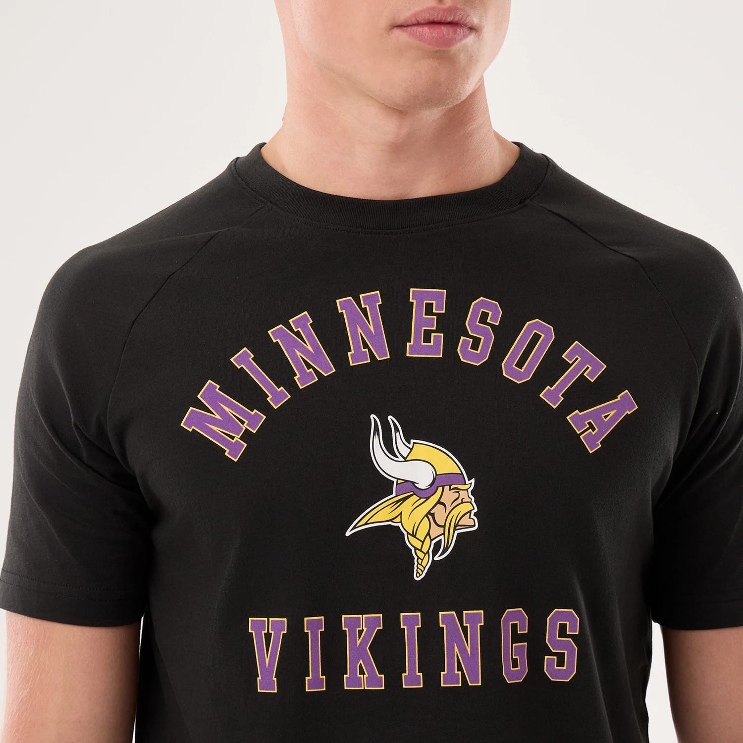 The model is wearing this NFL Sideline 2026 Minnesota Vikings T-Shirt in black. 3