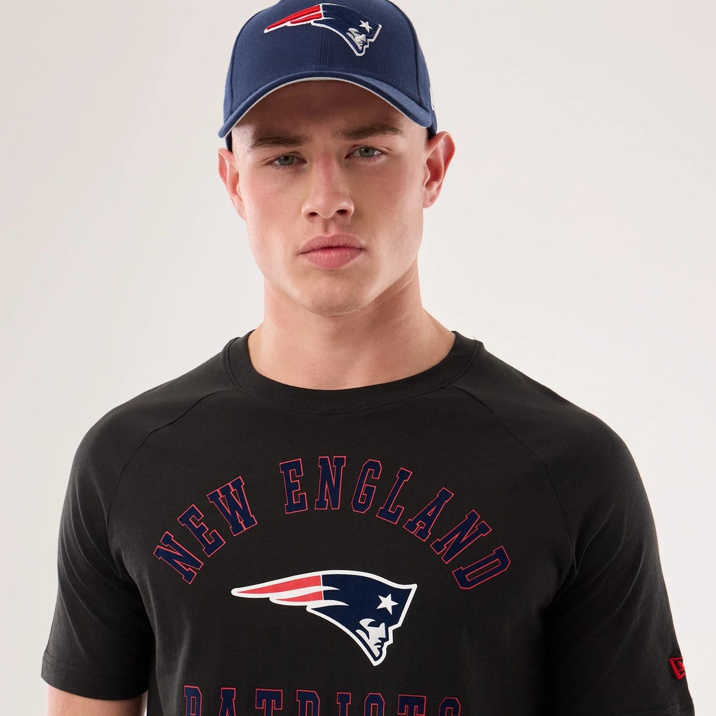 The model is wearing this NFL Sideline 2026 New England Patriots T-Shirt in black. 6