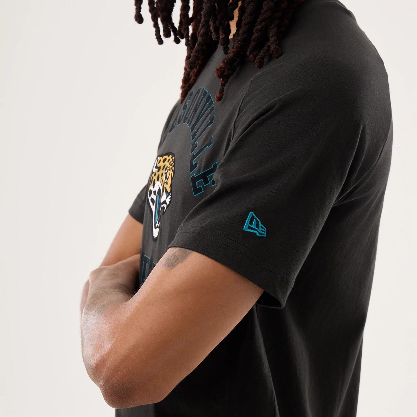 The model is wearing this NFL Sideline 2026 Jacksonville Jaguars T-Shirt in black. 5