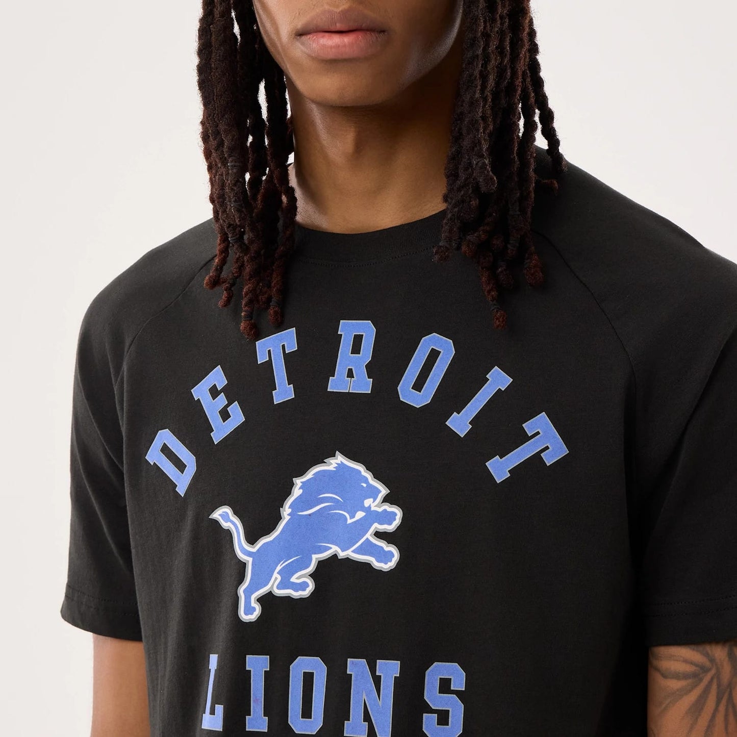The model is wearing this NFL Sideline 2026 Detroit Lions T-Shirt in black. 4