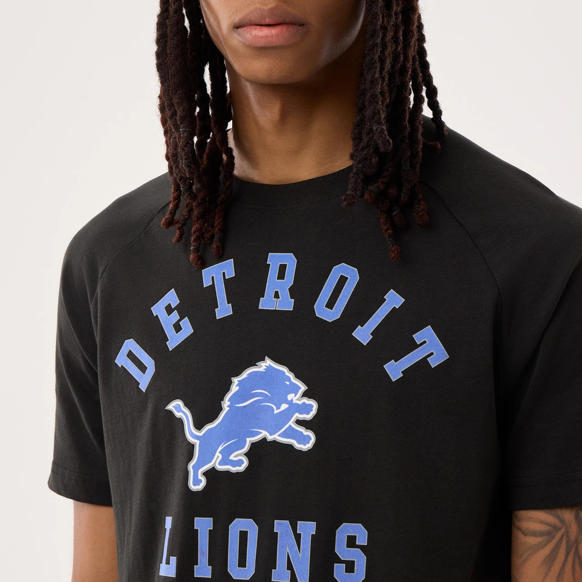 The model is wearing this NFL Sideline 2026 Detroit Lions T-Shirt in black. 4
