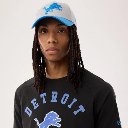 The model is wearing this NFL Sideline 2026 Detroit Lions T-Shirt in black. 6