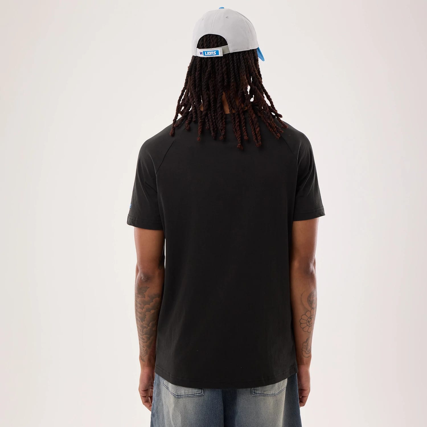 The model is wearing this NFL Sideline 2026 Detroit Lions T-Shirt in black. 2