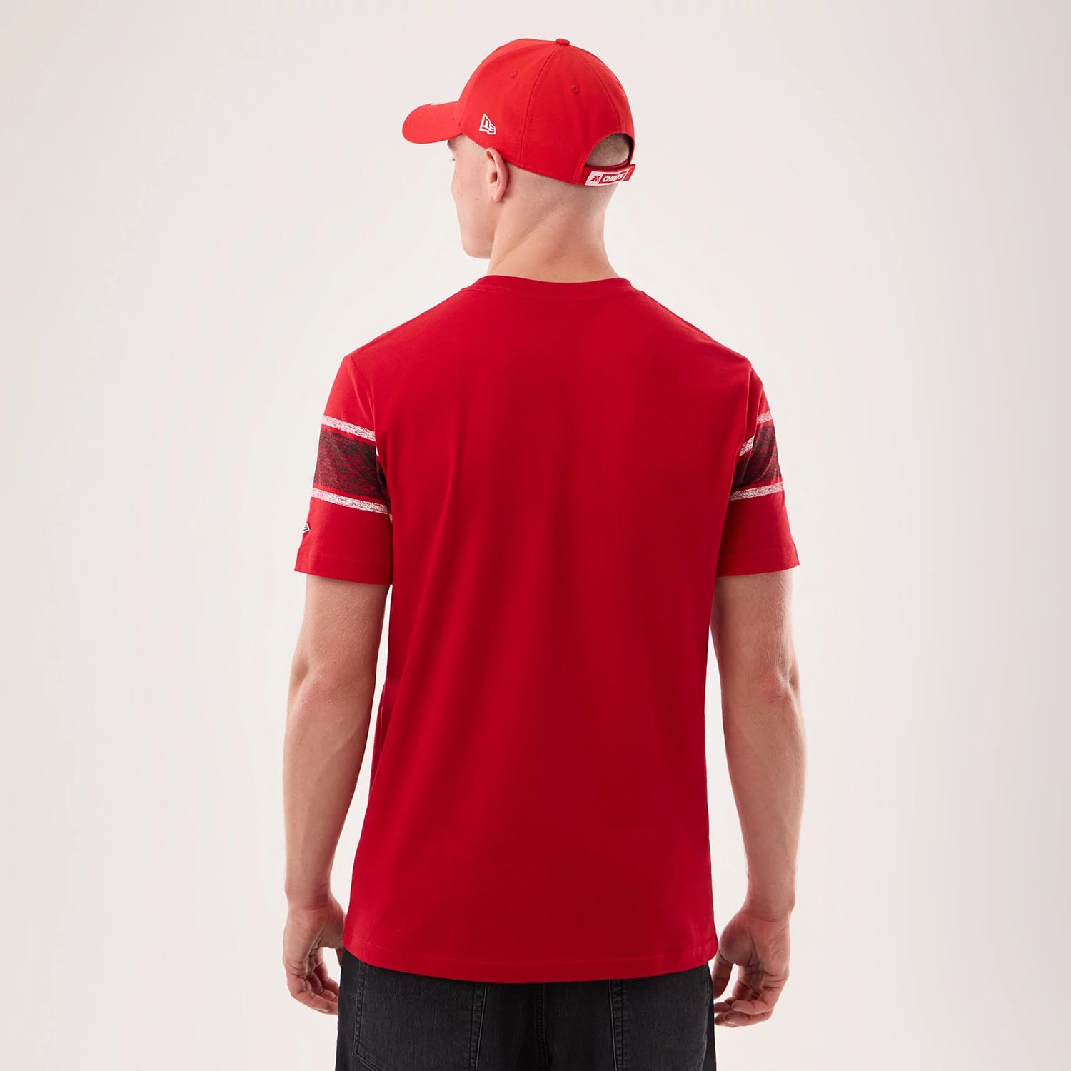 The model is wearing this NFL Sideline 2026 Kansas City Chiefs T-Shirt in red. 2