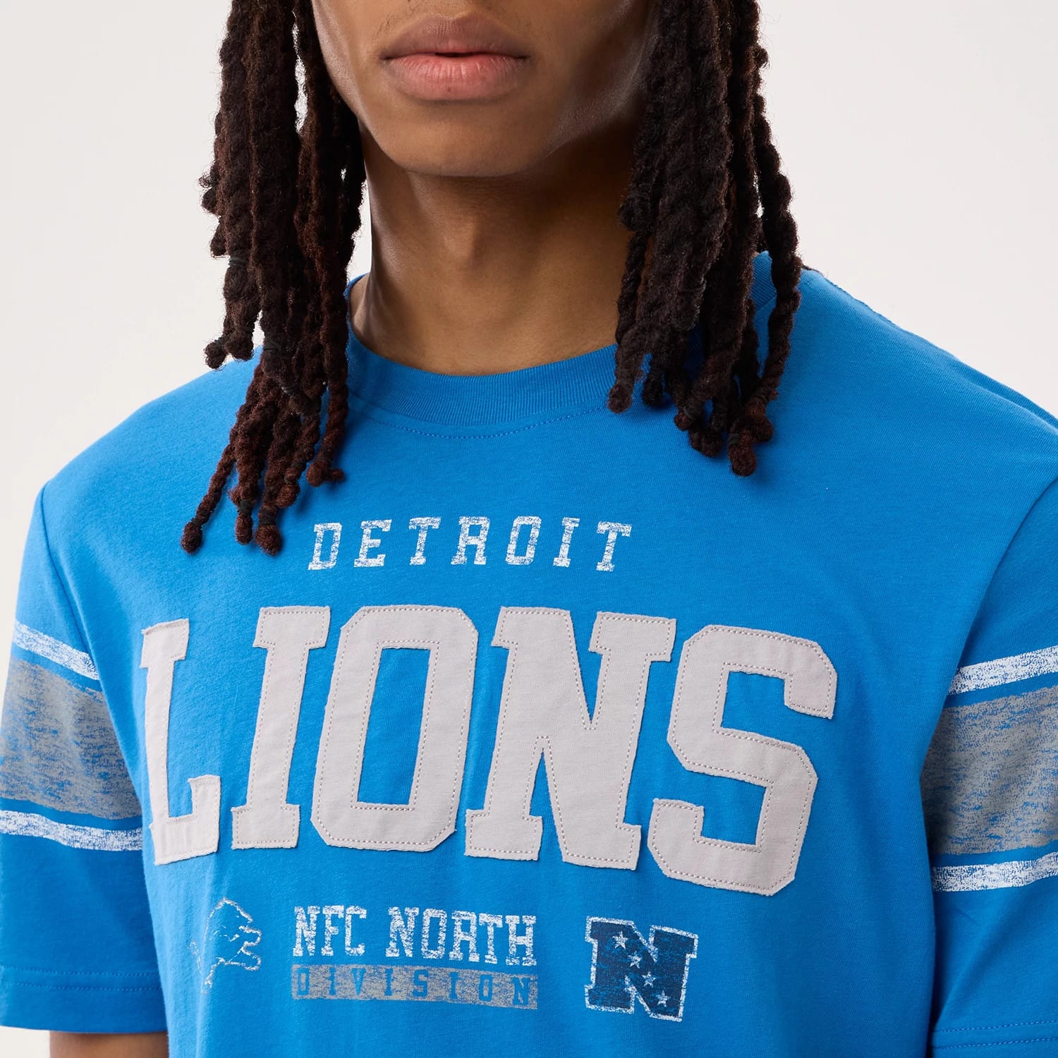 The model is wearing this NFL Sideline 2026 Detroit Lions T-Shirt in blue. 3