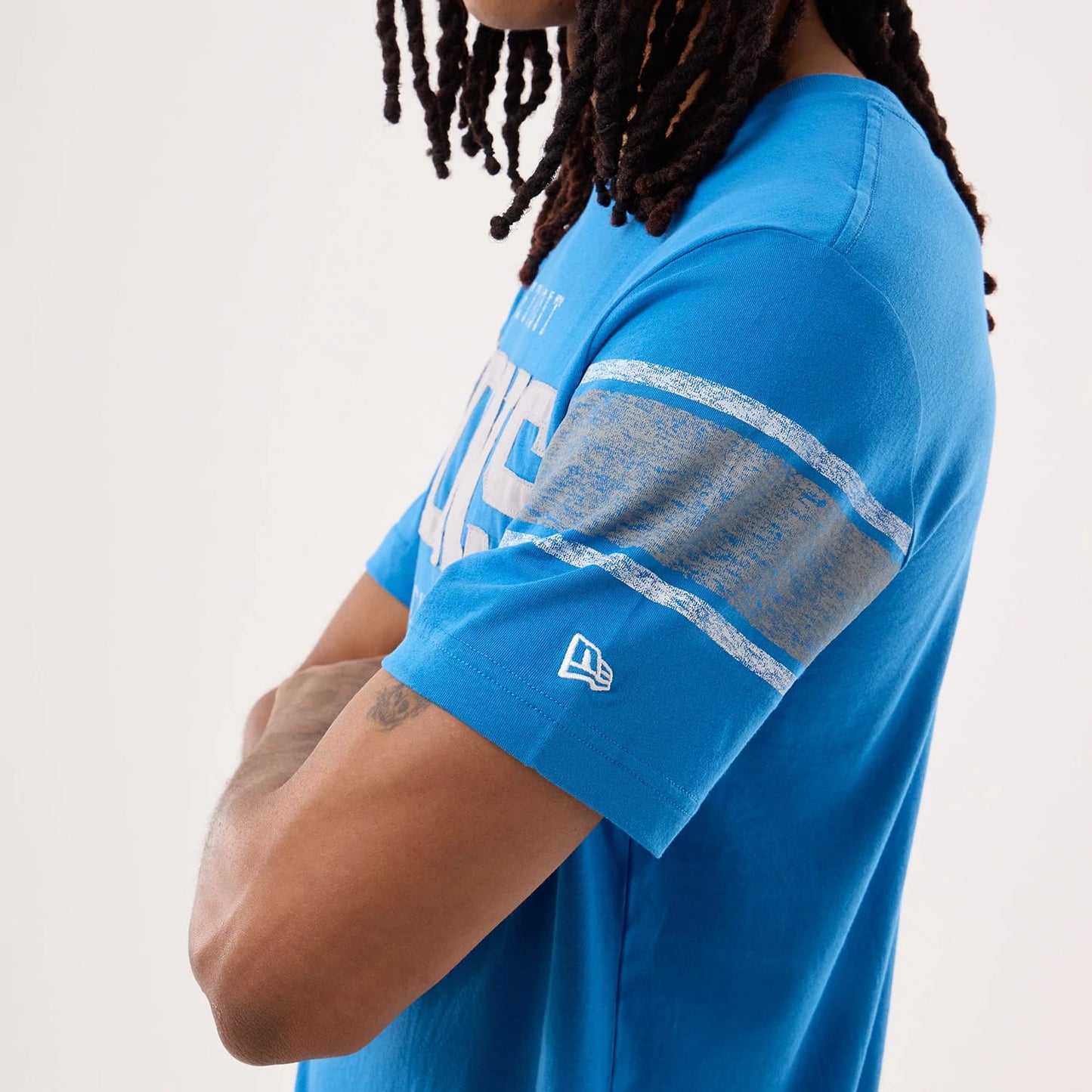 The model is wearing this NFL Sideline 2026 Detroit Lions T-Shirt in blue. 6