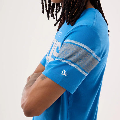 The model is wearing this NFL Sideline 2026 Detroit Lions T-Shirt in blue. 6