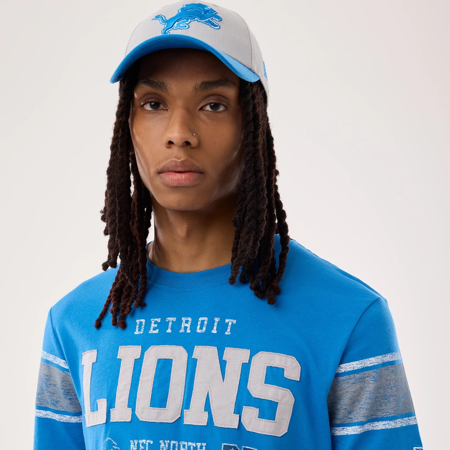 The model is wearing this NFL Sideline 2026 Detroit Lions T-Shirt in blue. 5