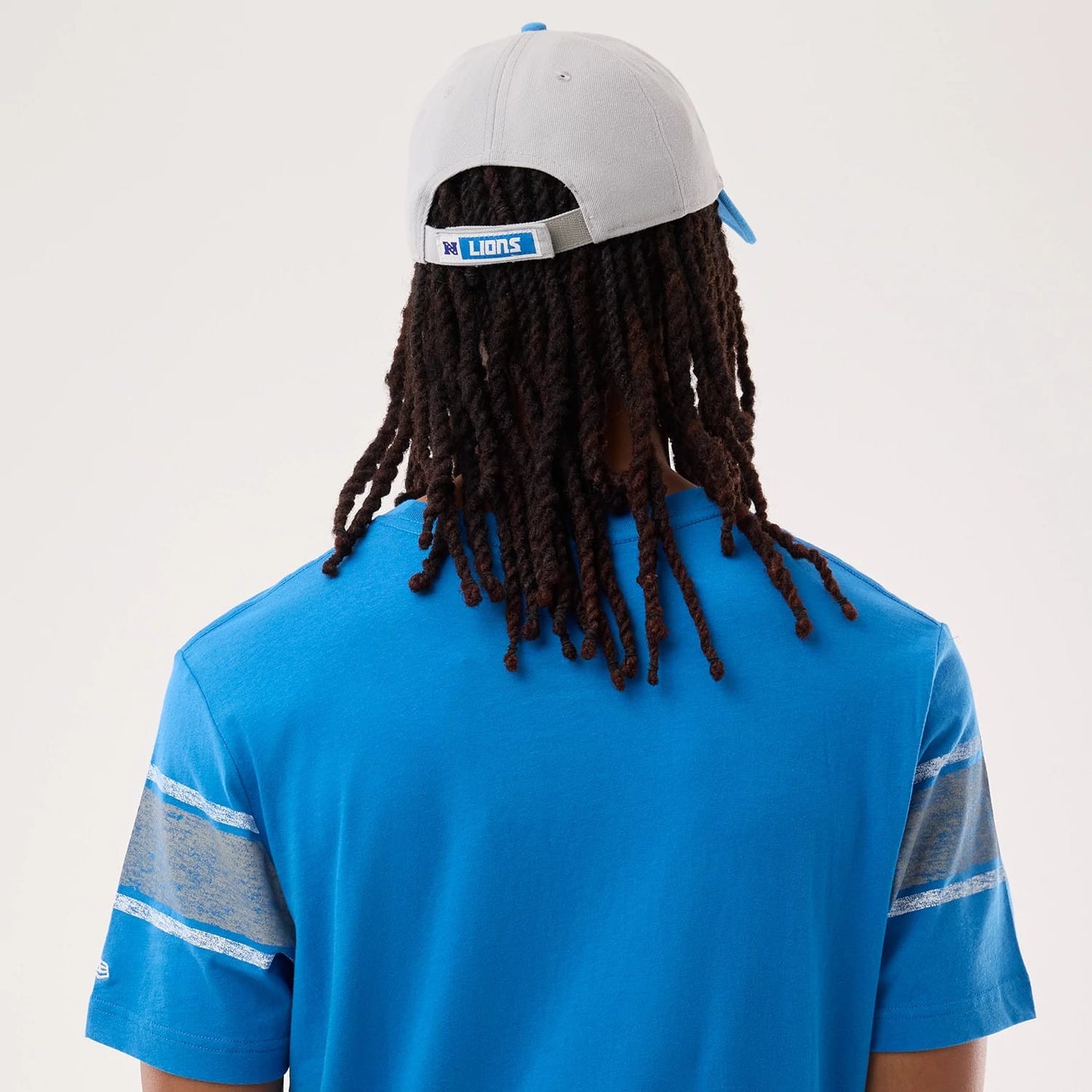 The model is wearing this NFL Sideline 2026 Detroit Lions T-Shirt in blue. 4