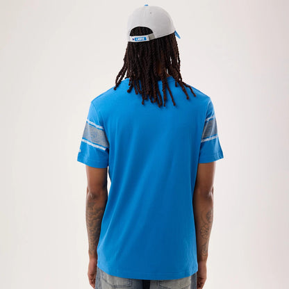 The model is wearing this NFL Sideline 2026 Detroit Lions T-Shirt in blue. 2