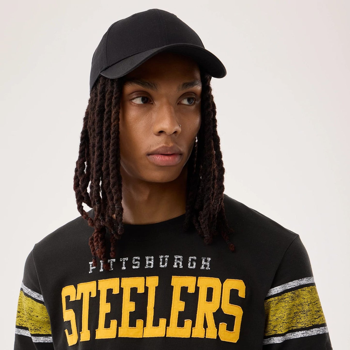 The model is wearing this NFL Sideline 2026 Pittsburgh Steelers T-Shirt in black. 7