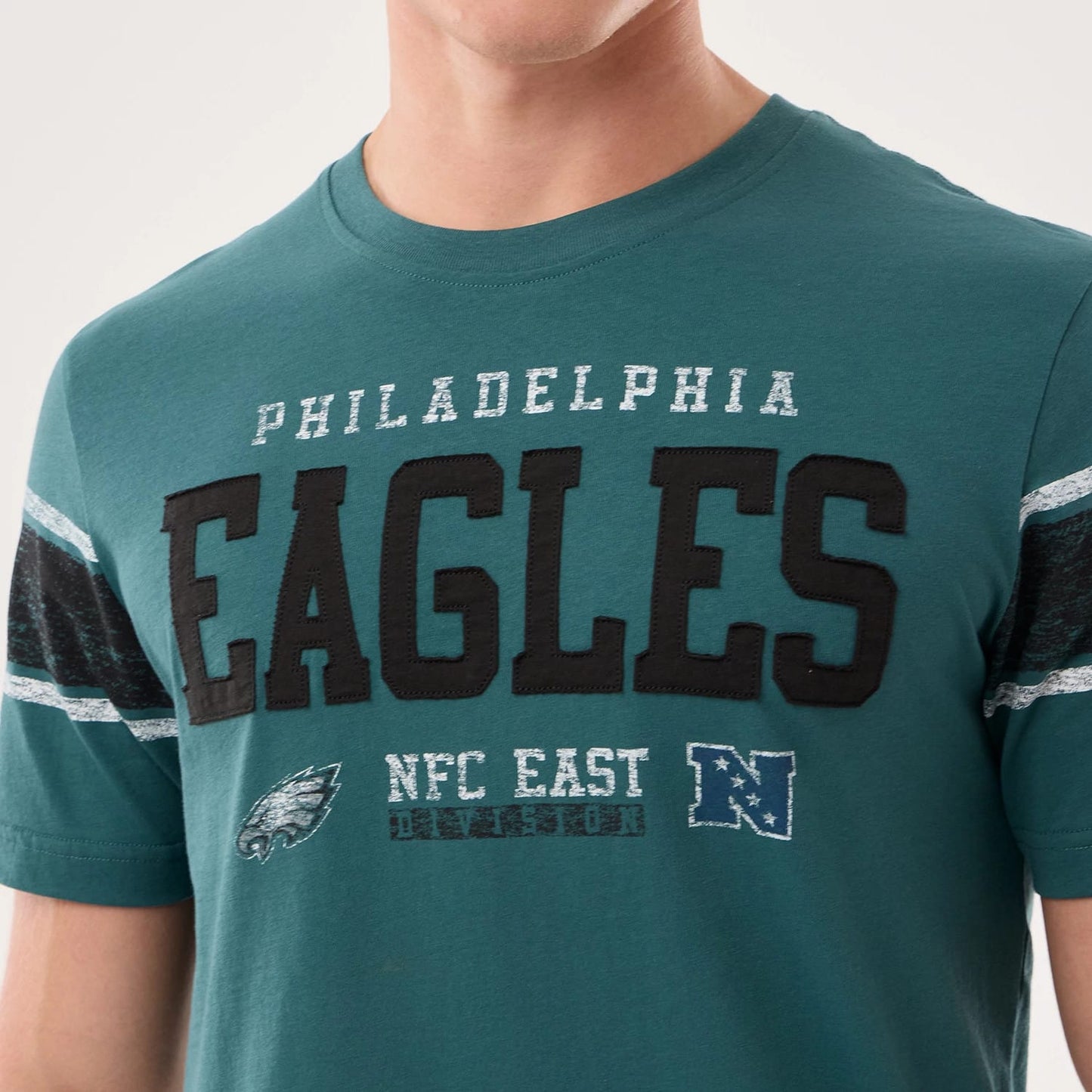 The model is wearing this NFL Sideline 2026 Philadelphia Eagles T-Shirt in dark green. 4