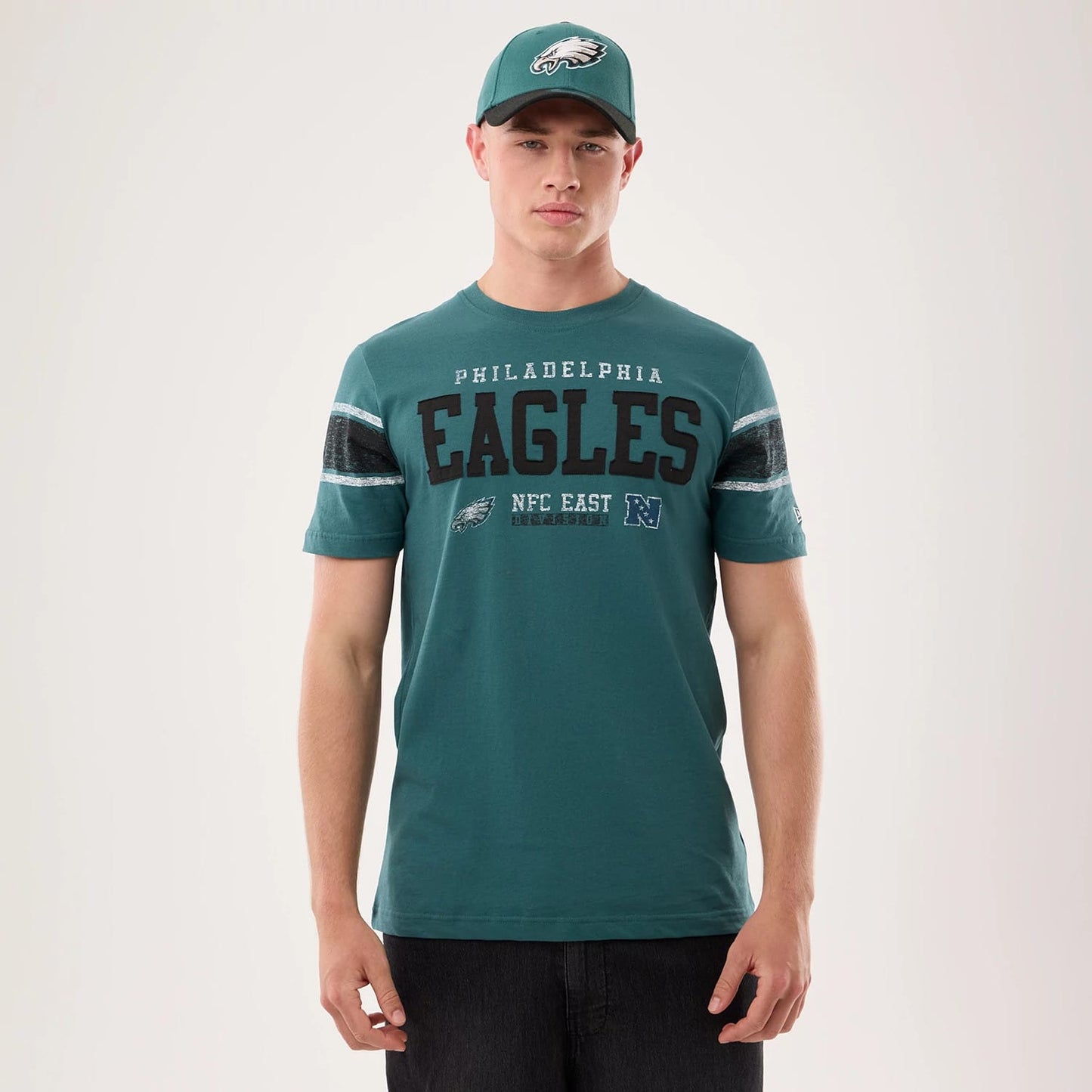 The model is wearing this NFL Sideline 2026 Philadelphia Eagles T-Shirt in dark green. 1