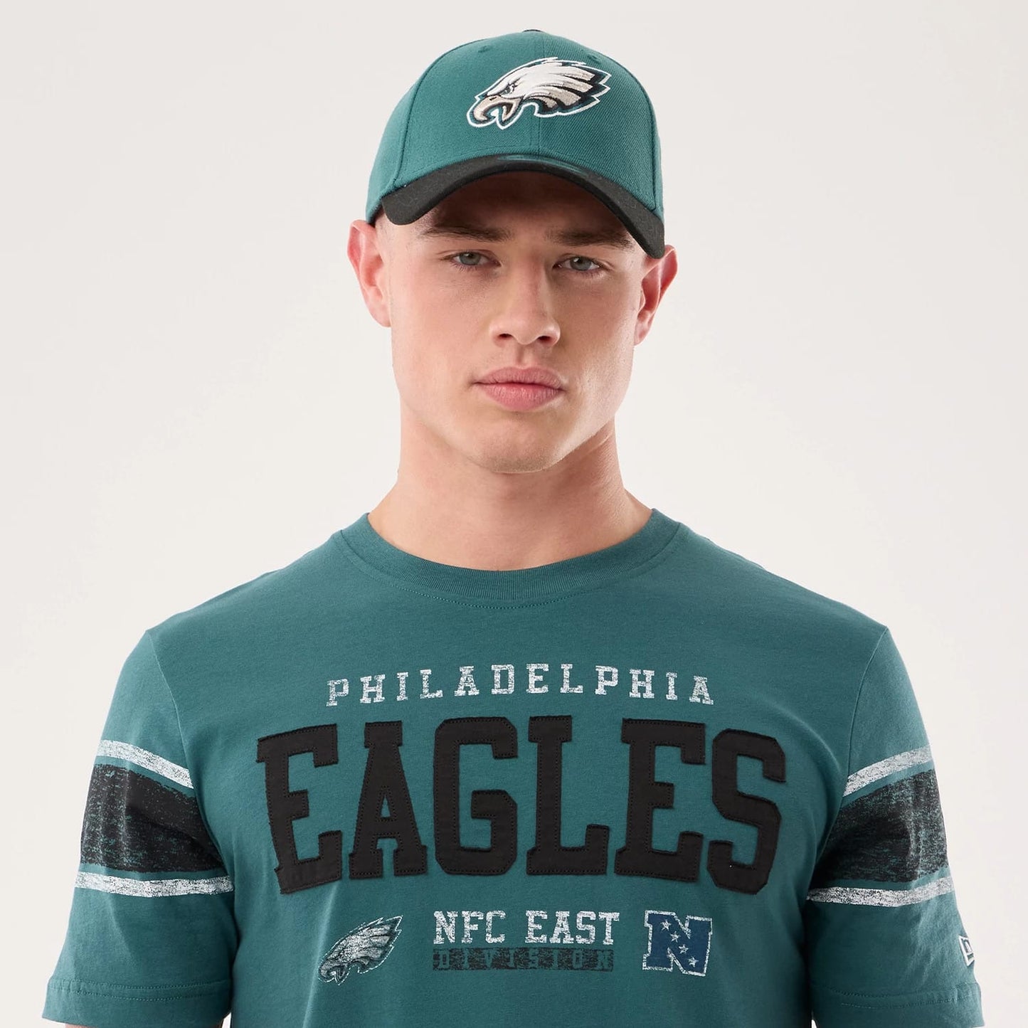 The model is wearing this NFL Sideline 2026 Philadelphia Eagles T-Shirt in dark green. 6