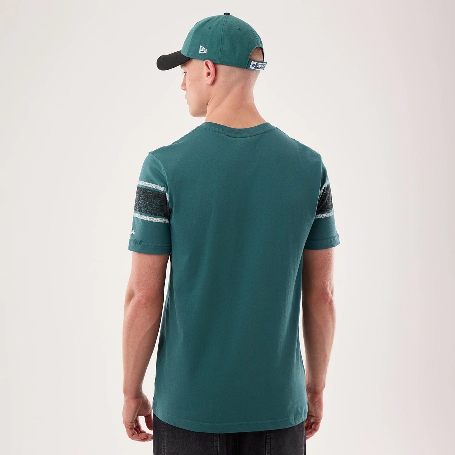 The model is wearing this NFL Sideline 2026 Philadelphia Eagles T-Shirt in dark green. 2
