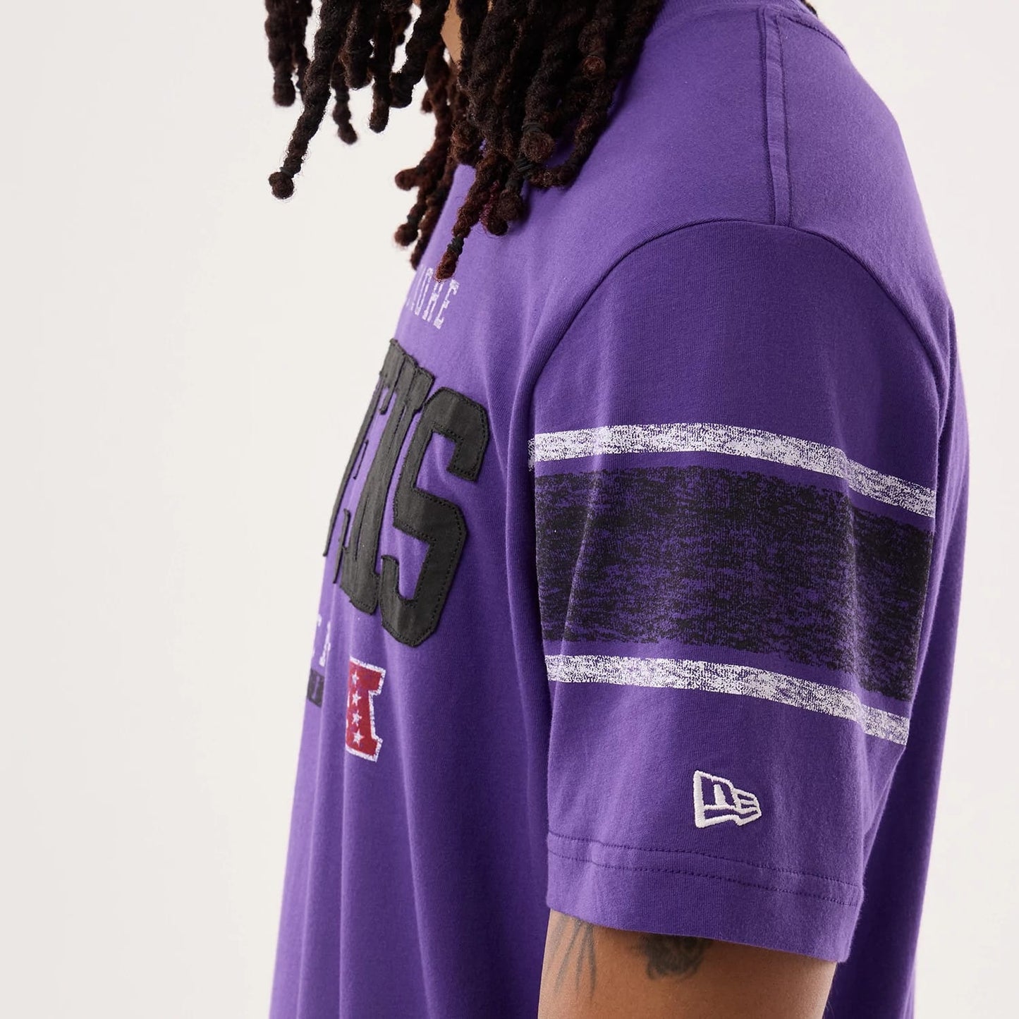 The model is wearing this NFL Sideline 2026 Baltimore Ravens T-Shirt in purple. 5