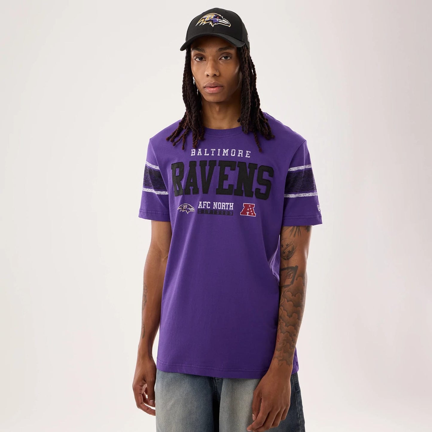 The model is wearing this NFL Sideline 2026 Baltimore Ravens T-Shirt in purple. 1