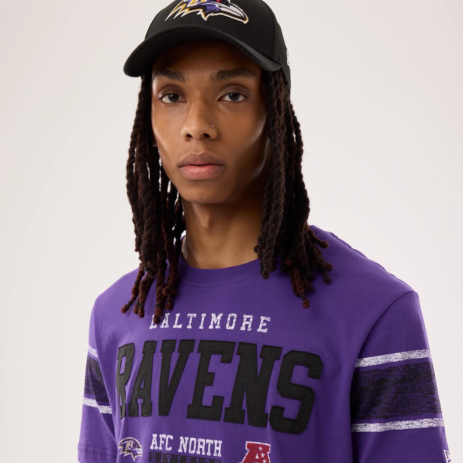 The model is wearing this NFL Sideline 2026 Baltimore Ravens T-Shirt in purple. 6