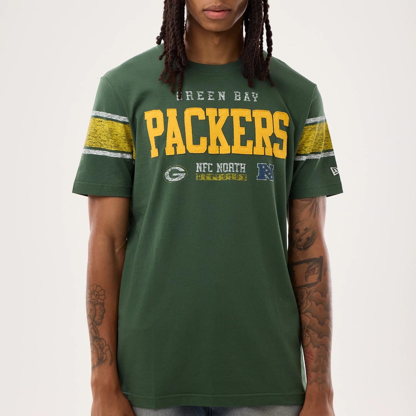 The model is wearing this NFL Sideline 2026 Green Bay Packers T-Shirt in dark green. 4