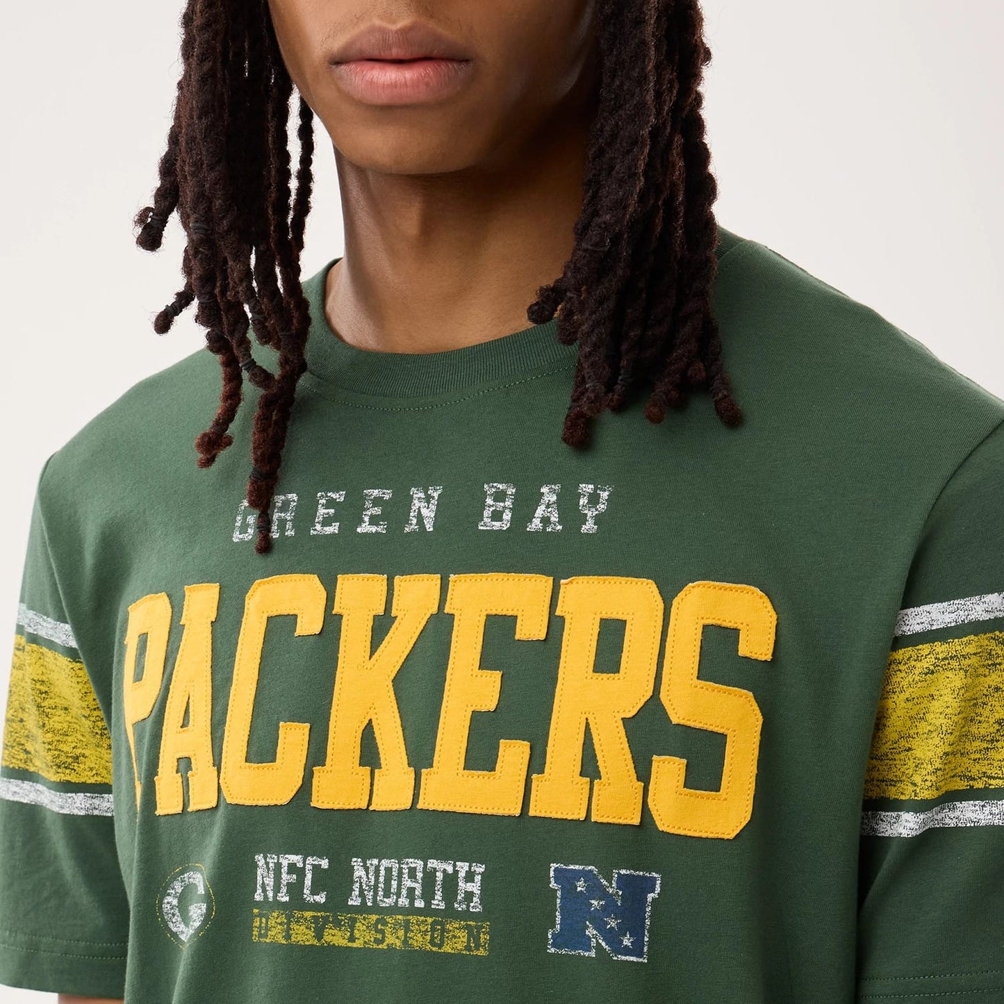 The model is wearing this NFL Sideline 2026 Green Bay Packers T-Shirt in dark green. 3