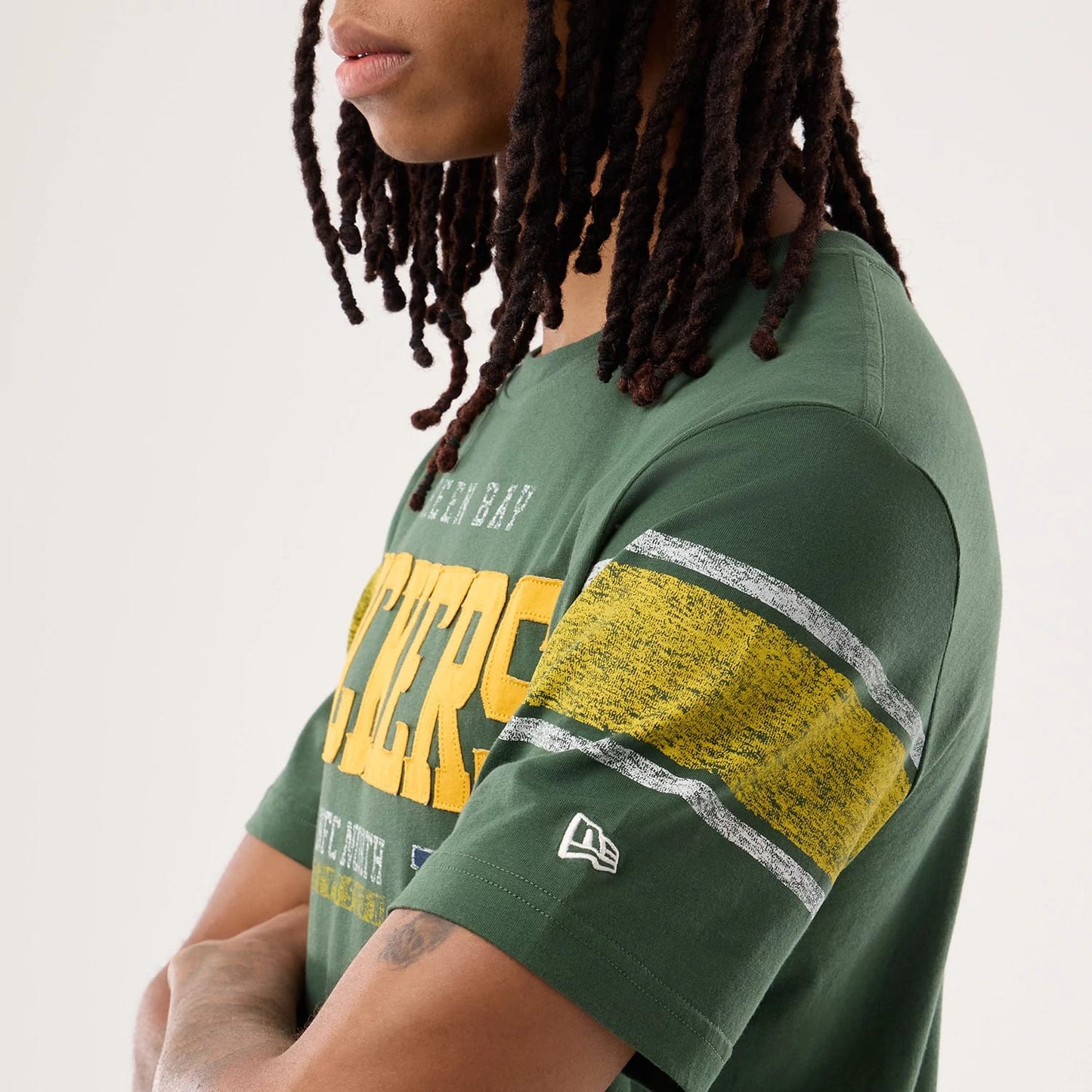 The model is wearing this NFL Sideline 2026 Green Bay Packers T-Shirt in dark green. 5