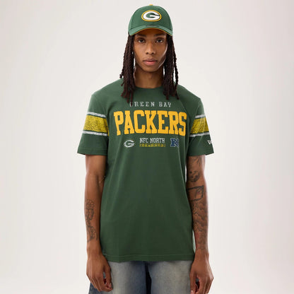 The model is wearing this NFL Sideline 2026 Green Bay Packers T-Shirt in dark green. 1