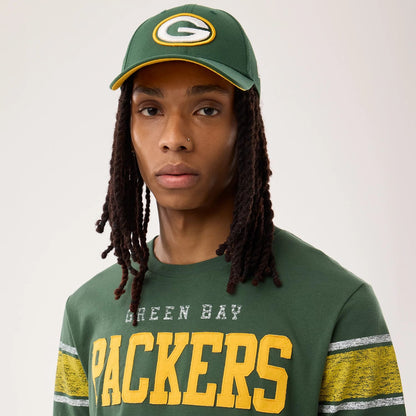 The model is wearing this NFL Sideline 2026 Green Bay Packers T-Shirt in dark green. 6