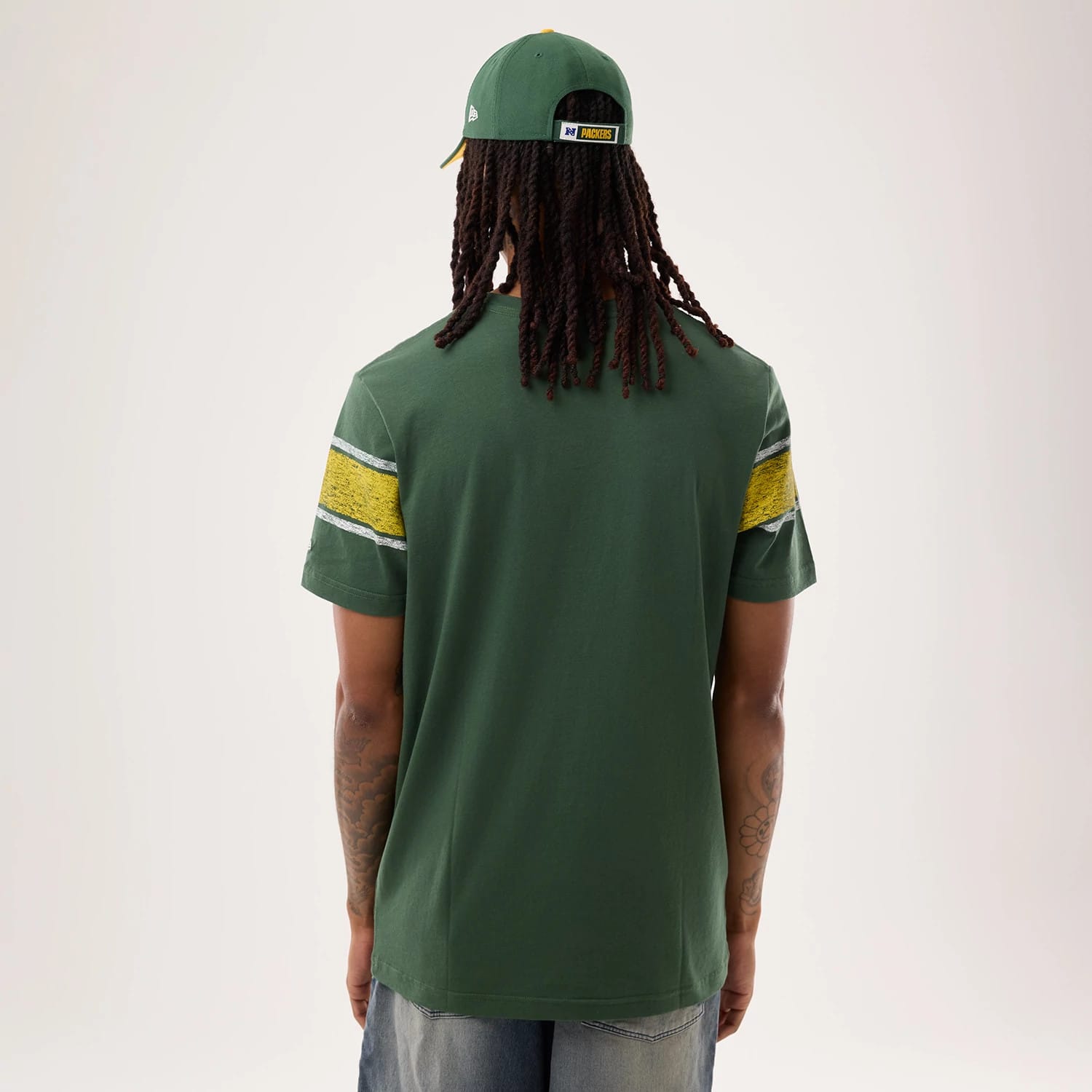 The model is wearing this NFL Sideline 2026 Green Bay Packers T-Shirt in dark green. 2