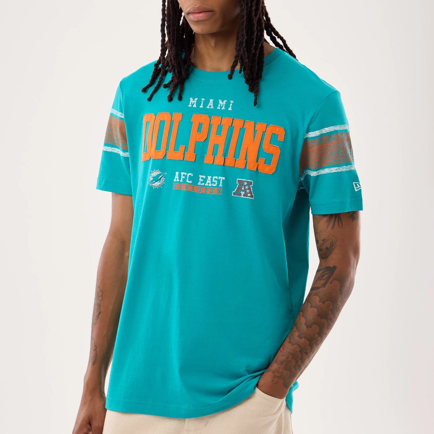 The model is wearing this NFL Sideline 2026 Miami Dolphins T-Shirt in turquoise. 4