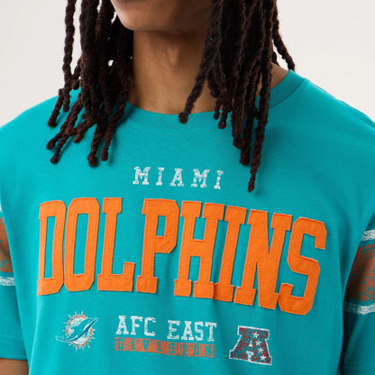 The model is wearing this NFL Sideline 2026 Miami Dolphins T-Shirt in turquoise. 3
