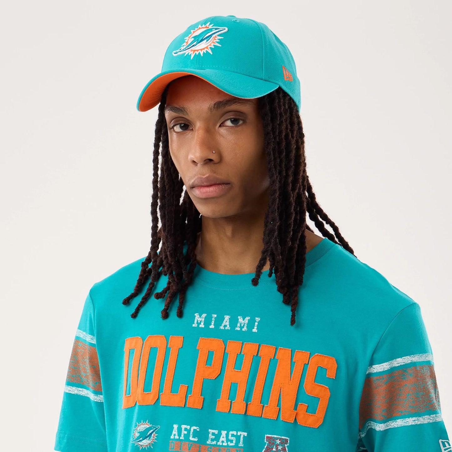 The model is wearing this NFL Sideline 2026 Miami Dolphins T-Shirt in turquoise. 6