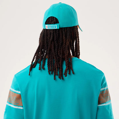 The model is wearing this NFL Sideline 2026 Miami Dolphins T-Shirt in turquoise. 7