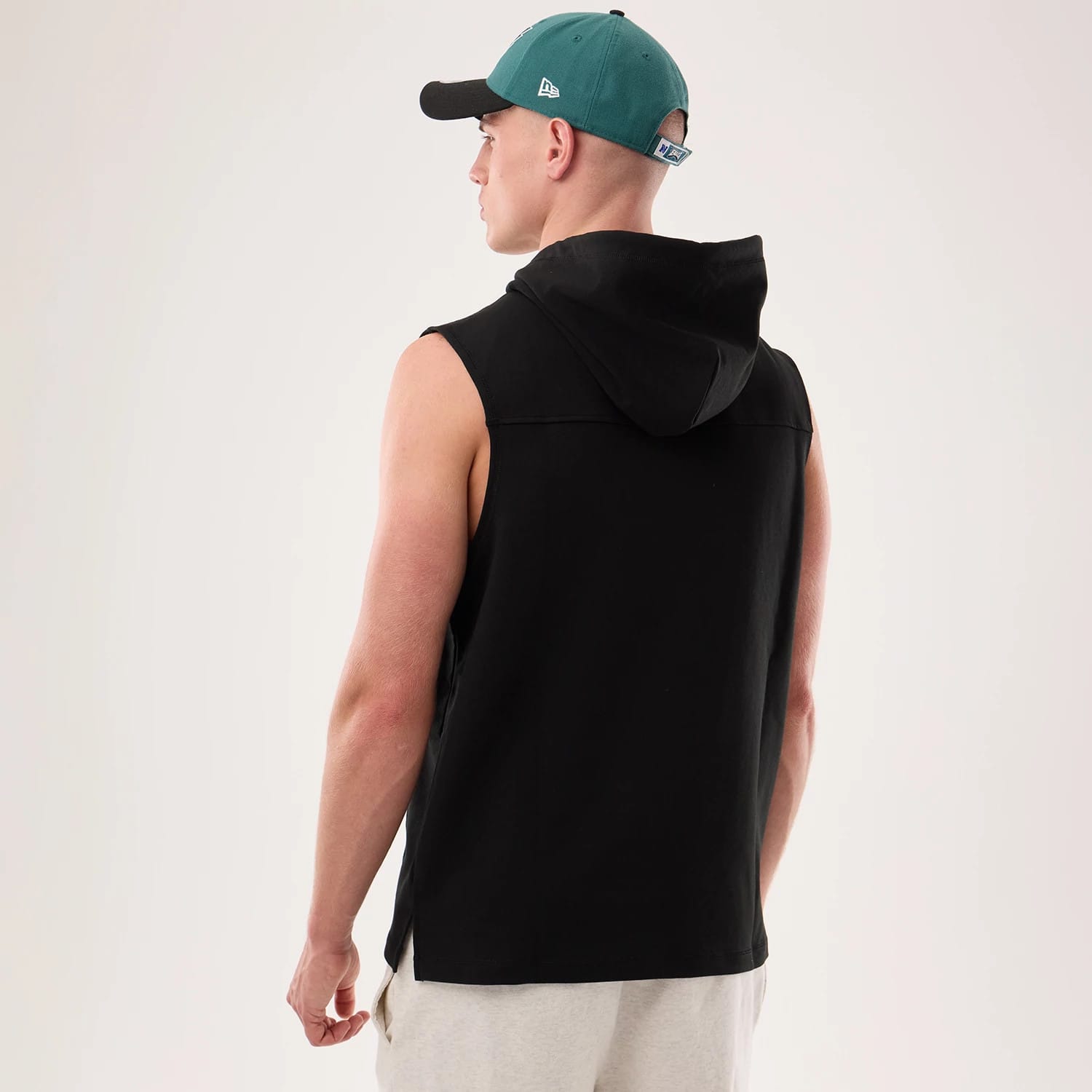 The model is wearing this NFL Sideline 2026 Philadelphia Eagles Tank Top in black. 2