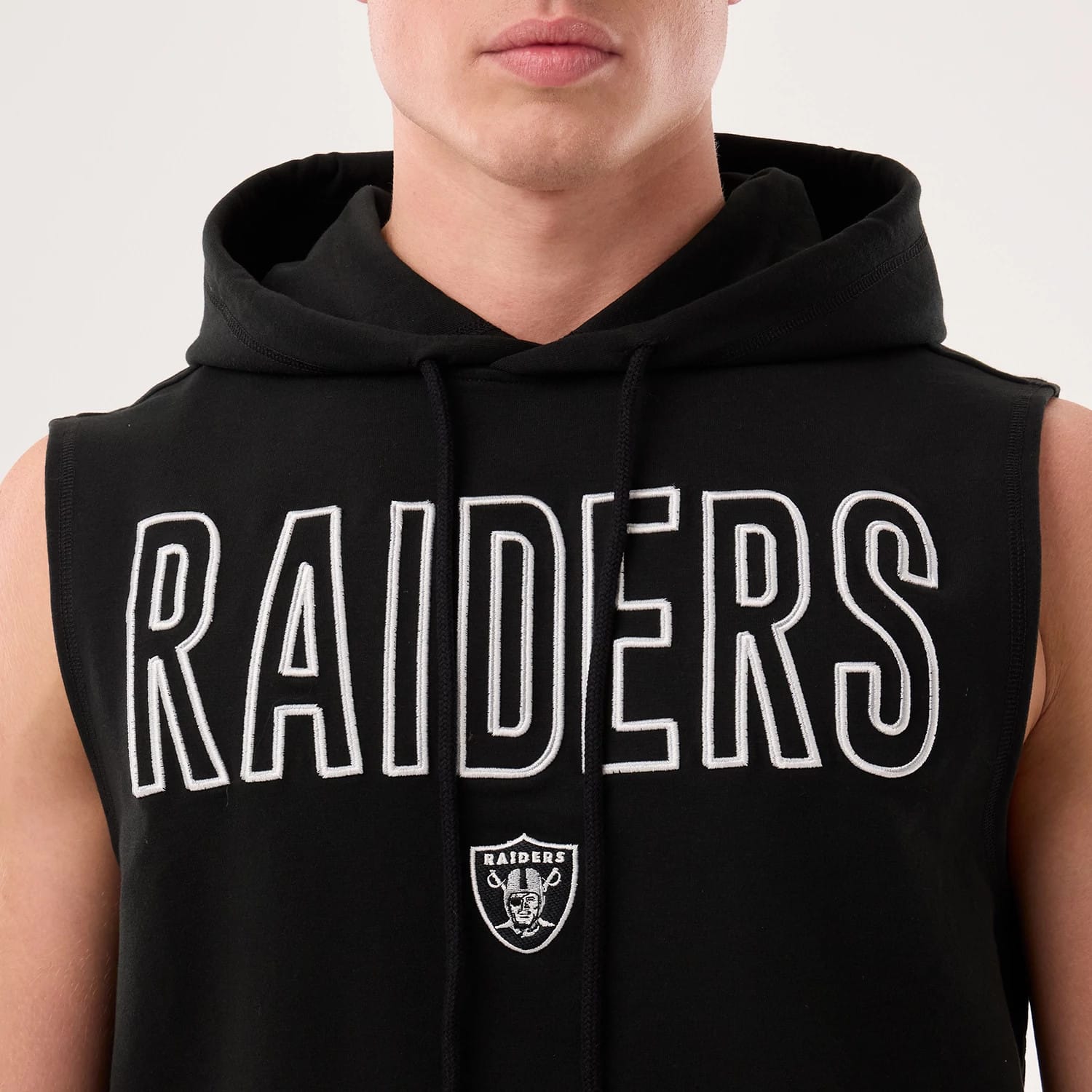 The model is wearing this NFL Sideline 2026 Las Vegas Raiders Tank Top in black. 4