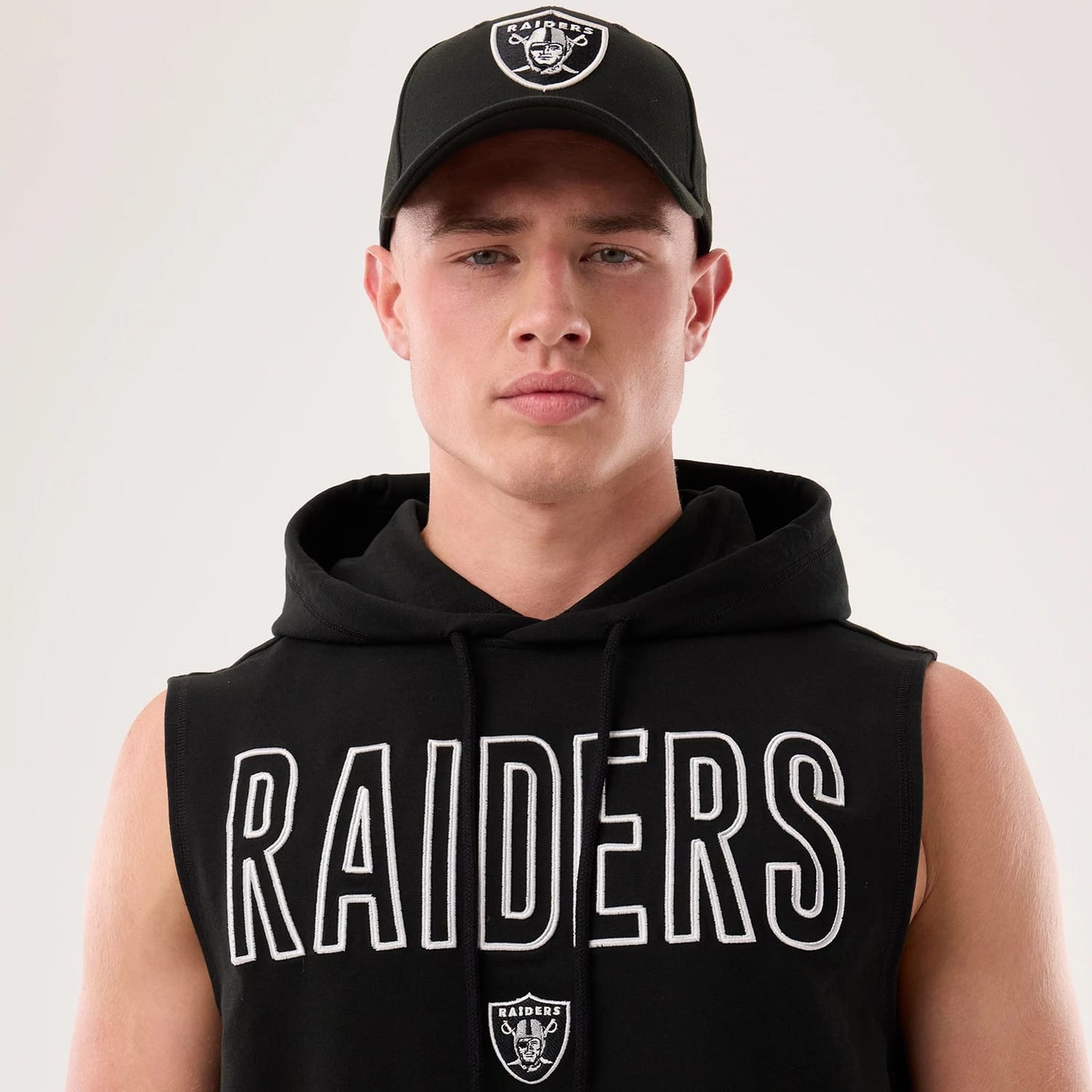 The model is wearing this NFL Sideline 2026 Las Vegas Raiders Tank Top in black. 6