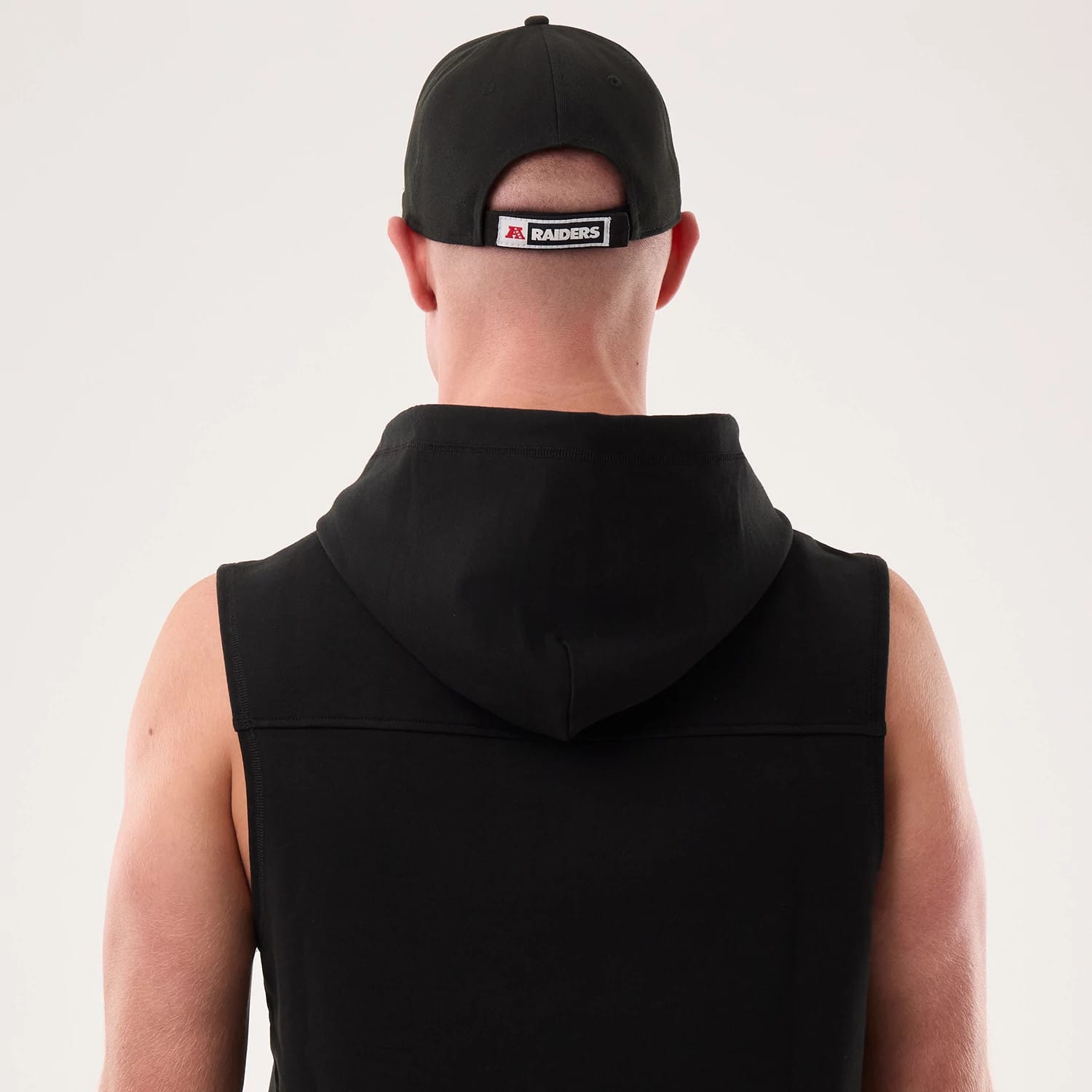 The model is wearing this NFL Sideline 2026 Las Vegas Raiders Tank Top in black. 7